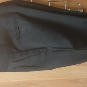 A pair of dress slacks for men by Stefano armondi black size 32/34